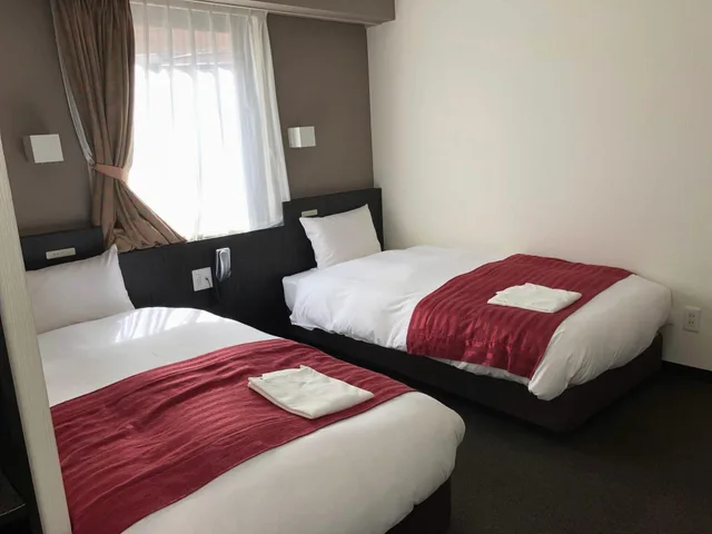 غرفة بسريرين منفصلين في المبنى الرئيسي للمدخنين، Kawasaki River Hotel 1/1