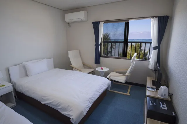 غرفة كومفورت بسريرين منفصلين وسريرين مزدوجين بإطلالة على البحر، Hotel Hoshitate Iriomotejima (ex Seaside Hotel Blue Moon) 1/1