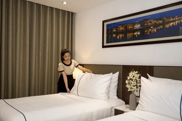 غرفة بريميير ثلاثية بسرير كوين وسرير فردي، Pavilion Hotel Da Nang 5/8