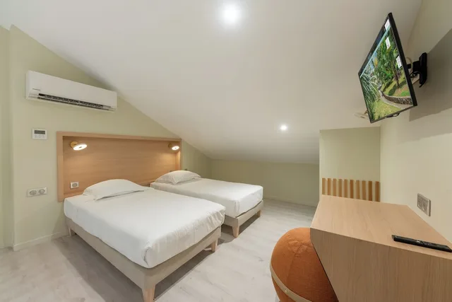 غرفة كومفورت رباعية بسرير كوين وسريرين منفصلين، La Pagerie Tropical Garden Hotel 1/2