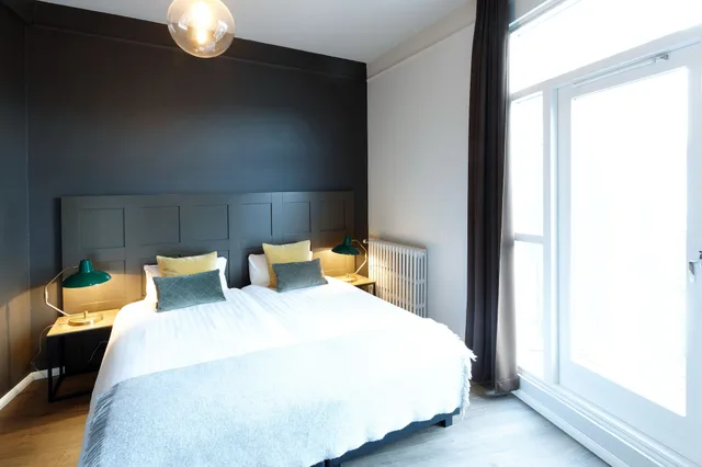 جناح عائلي بسريرين منفصلين وأسرّة بطابقين مع أريكة، Fosshotel Baron 1/4