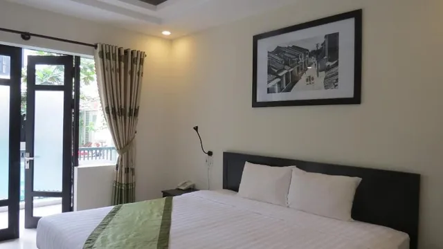 غرفة ديلوكس بسرير كينج بشرفة، Starfruit Homestay Hoi An 4/10