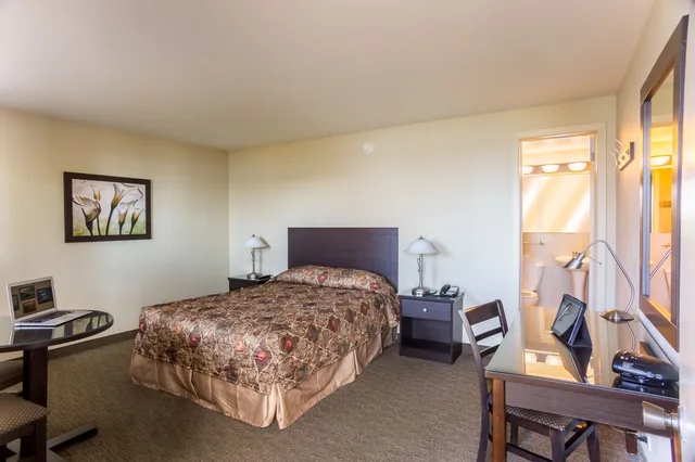 غرفة سوبيريور بسرير كوين بإطلالة على النهر، Motel Et Appartements Du Fleuve 1/3
