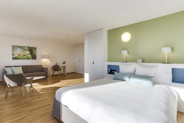 غرفة عائلية بسرير كوين مع أريكة، Hotel des Patients 1/3