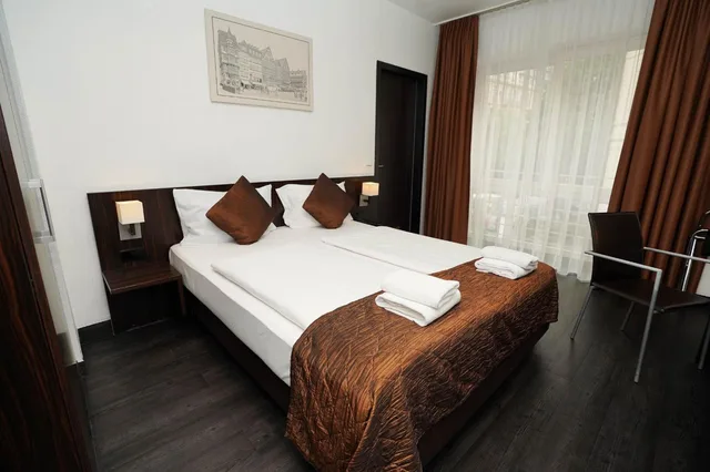 غرفة بسرير كينج، The Atrium Hotel 1/9