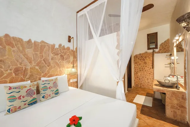 غرفة سوبيريور ثلاثية بسرير كينج وسرير فردي بإطلالة جزئية على البحر، Mvuvi Boutique Resort 3/6