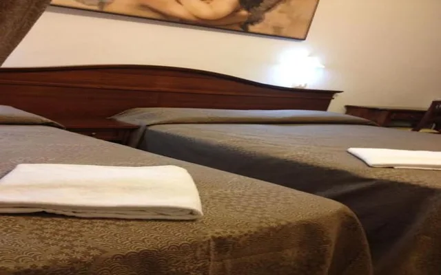 غرفة كلاسيكية ثلاثية بسرير مزدوج وسرير فردي، Rome City Inn 3/3