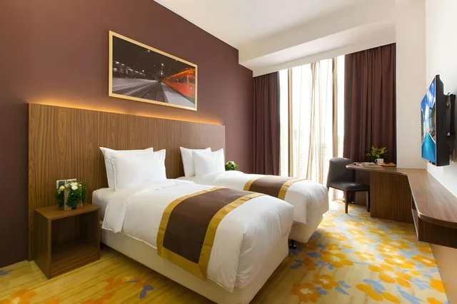 غرفة ديلوكس بسرير كوين، Bay Hotel Ho Chi Minh 1/2