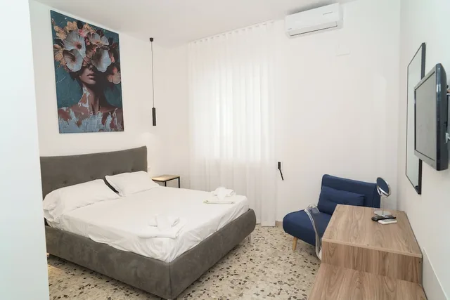 غرفة كومفورت ثلاثية بسرير كوين وسرير فردي في الطابق الأرضي، B&B Il Geranio 1/10