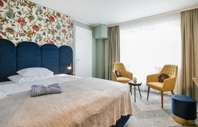 جناح بسرير كينج مع أريكة، Arcotel Wimberger 1/2