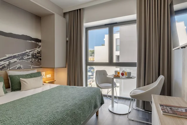 غرفة عائلية بسرير كوين وسريرين منفصلين، Lagrange Apart Hotel - Les Jardins de l Olympie 6/10