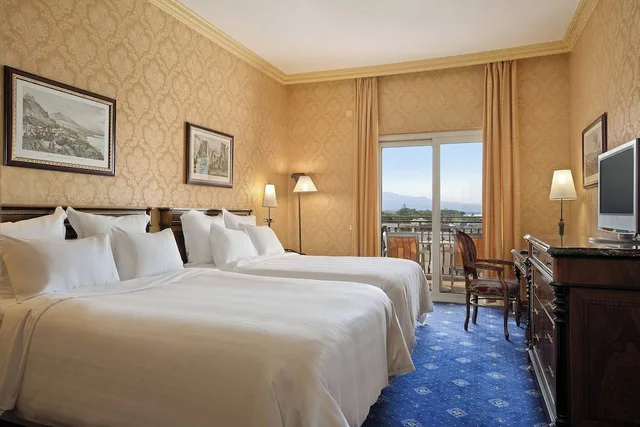 غرفة سوبيريور بسريرين كوين بإطلالة جزئية على البحر، Delta Hotels by Marriott Giardini Naxos 1/2