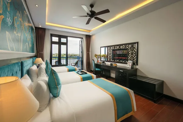 غرفة بريميوم ثلاثية بإطلالة على النهر بشرفة، Silk River Hoi An Hotel & Spa 1/4