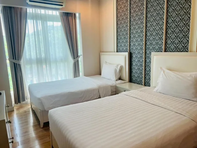 غرفة بسريرين منفصلين بحوض استحمام، Harmony Resort Hotel 2/10