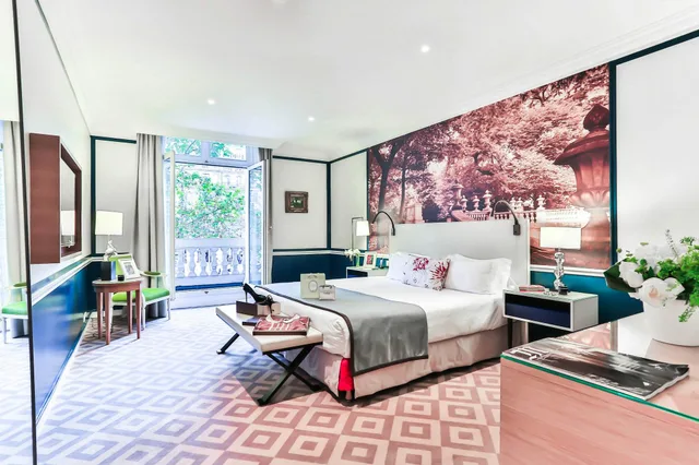جناح ديلوكس بسرير كينج بغرفة نوم واحدة مع أريكة، Fraser Suites Le Claridge Champs-Elysees 2/2