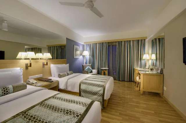 غرفة ديلوكس بسريرين منفصلين، Pride Plaza Hotel Ahmedabad 1/1