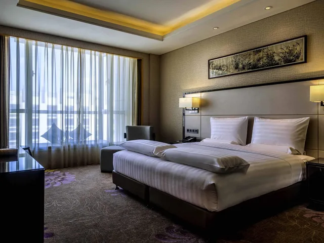 جناح تنفيذي بسرير كينج، Pullman Qingdao Ziyue 1/3