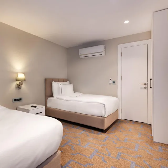 2 Bedrooms, Suite, King Bed, Gleam Collection Hotel 2/5
