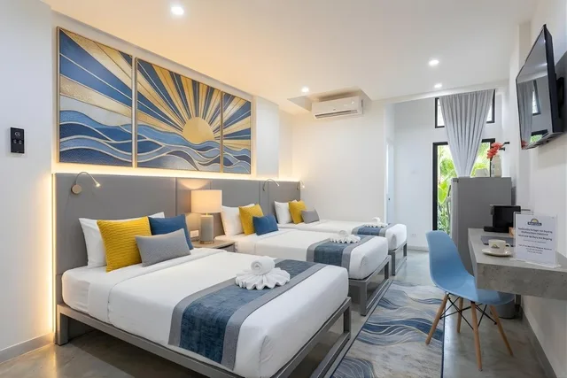 غرفة بريميير ثلاثية بسرير كوين وسرير فردي بشرفة بمطبخ صغير، SCN City Hotel 1/1