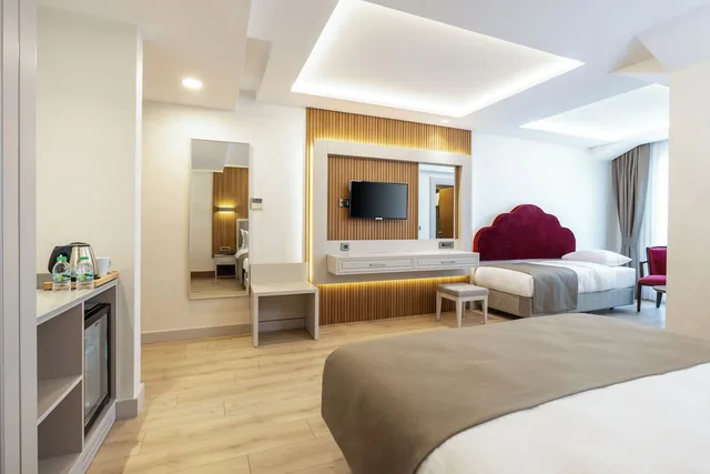 غرفة ديلوكس بسرير كوين، CARINA GOLD HOTEL 3/4