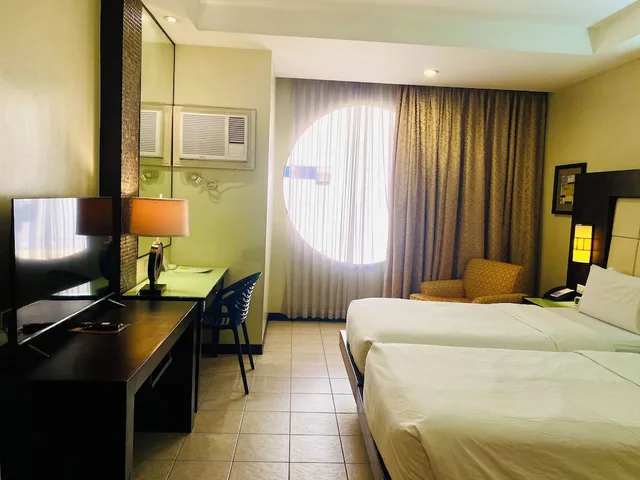 غرفة ديلوكس بسريرين منفصلين مع سرير إضافي، Circle Inn Hotel and Suites 3/4