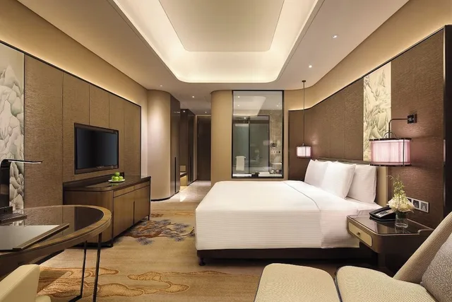 غرفة ديلوكس بسرير كينج بإطلالة على الجبل، Wanda Realm Taian 4/8