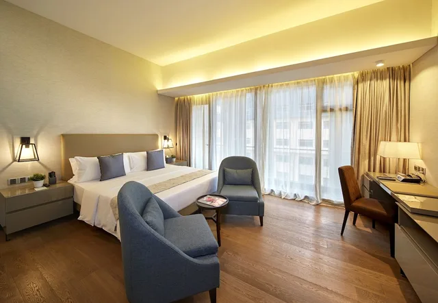 جناح تنفيذي بسرير كينج وسريرين فرديين بغرفتي نوم، Im Hotel 1/3