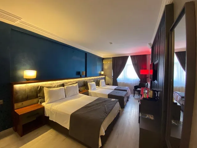 غرفة قياسية رباعية بسرير مزدوج وسريرين منفصلين، Green Hotel 1/6