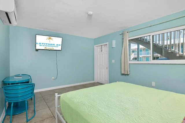 جناح ديلوكس بسرير كينج وسرير كوين بغرفتي نوم بمطبخ، Latitude 26 Waterfront Resort & Marina 4/9