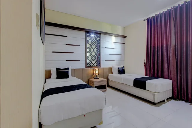 غرفة ديلوكس بسريرين منفصلين، Collection O near Stadion Manahan formerly Graha Laweyan Solo 5/6
