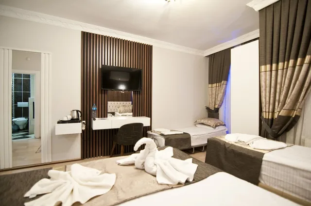 غرفة عائلية رباعية بسرير مزدوج وسريرين منفصلين، Hotel Broken Column 5/9