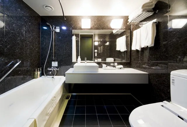 غرفة ديلوكس ثلاثية بسريرين منفصلين مع أريكة، Daiwa Roynet Hotel Kyoto Hachijoguchi 4/4
