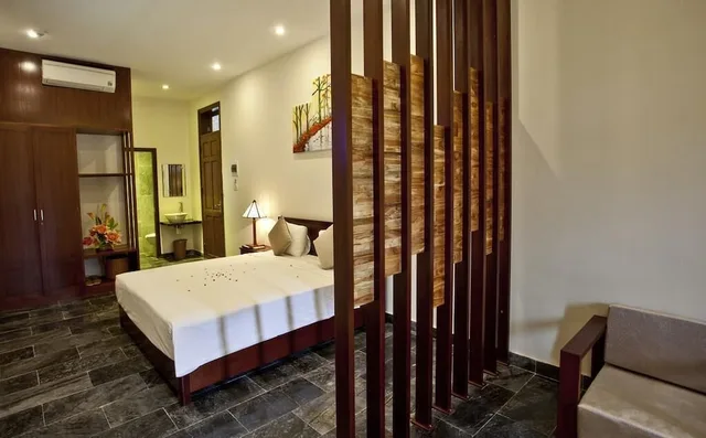 جناح جونيور بسرير كينج بإطلالة على الحديقة، Hoi An Tnt Villa 1/2