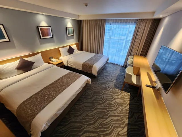 غرفة عائلية بسريرين منفصلين بشرفة، Seogwipo JS Hotel 2/10