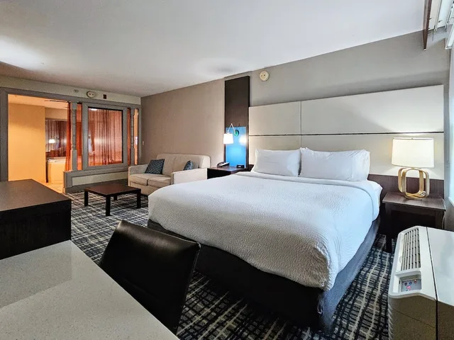 Suite, King Bed, Living and Dining Areas, Holliday Inn Belcamp Aberdeen Area Ex Wingate By Wyndham Aberdeen Edgewood 3/10