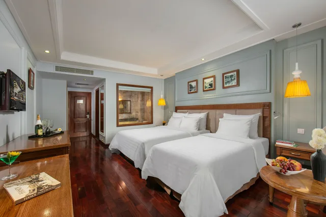 غرفة ديلوكس ثلاثية بسرير كوين وسرير فردي بإطلالة على المدينة، Hanoi Pearl Hotel 5/10