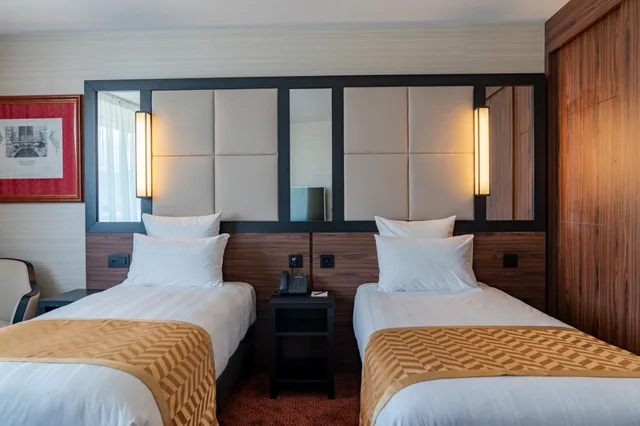 غرفة مفردة بسريرين منفصلين، Nash Suites Hotel 2/4