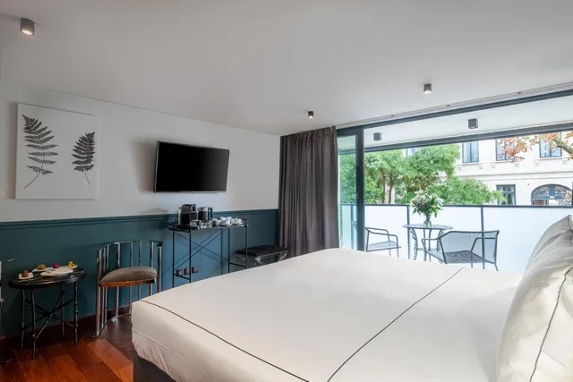 غرفة ديلوكس بسرير مزدوج بإطلالة على الحديقة بشرفة، Hotel Le Palais Gallien 4/6