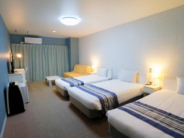 غرفة ثلاثية بثلاثة أسرّة، Hotel Caretta Amami 3/5