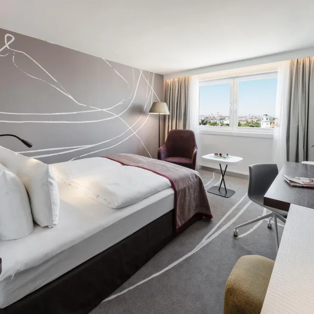 غرفة بريميوم بسرير كينج وسرير كوين بإطلالة على المدينة، Holiday Inn Munich - City Centre 3/8