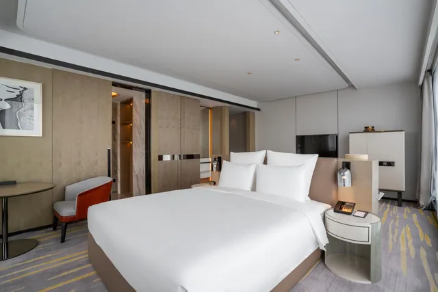 غرفة ديلوكس بسرير كينج وسرير كوين، Pullman Suzhou Zhonghui 2/5