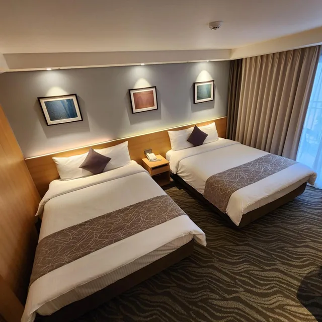 غرفة عائلية بسريرين منفصلين بشرفة، Seogwipo JS Hotel 5/10