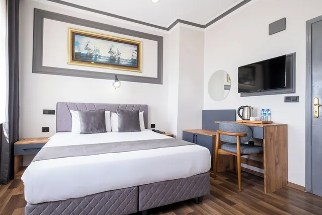 جناح عائلي بسرير كوين وسريرين منفصلين بإطلالة على البحر، Sur Hotel 5/10