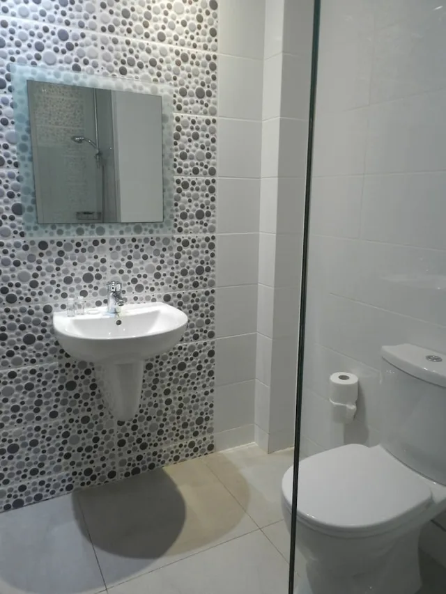 شقة ديلوكس بثلاثة أسرّة بغرفة نوم واحدة مع أريكة، Evabelle Napa Hotel Apartments 3/4