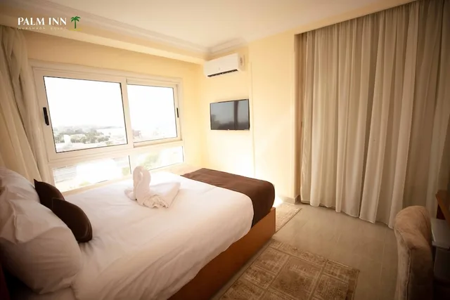 غرفة مفردة بسرير كوين، Palm Inn Hotel 1/9