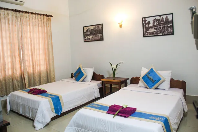 غرفة بسريرين مزدوجين، Tropical Breeze Guesthouse 1/1
