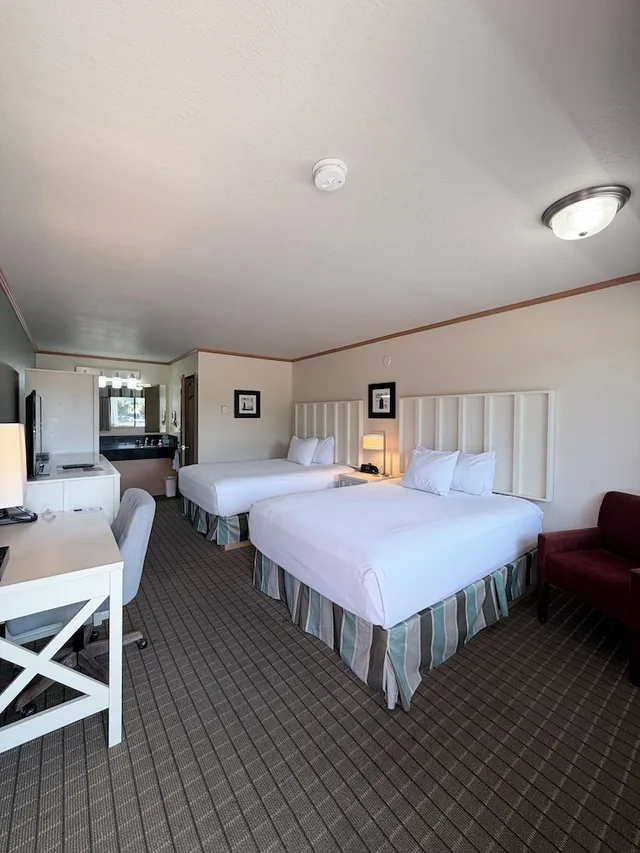 Room, 2 Queen Beds, River House Inn, a Baymont by Wyndham 1/4