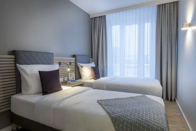 شقة بسرير كوين وسريرين منفصلين بغرفتي نوم مع أريكة، Citadines Arnulfpark Munich 1/12