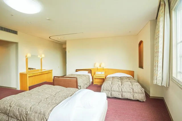 غرفة بسريرين منفصلين وفرشتي فوتون بحوض استحمام لذوي الإعاقة، Kamenoi Hotel Fukui 1/3