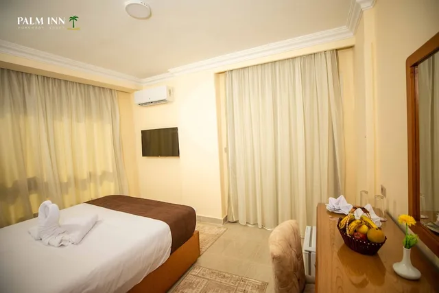 غرفة مفردة بسرير كوين، Palm Inn Hotel 4/9